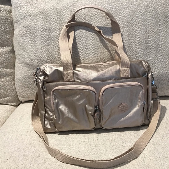 kipling front pocket satchel